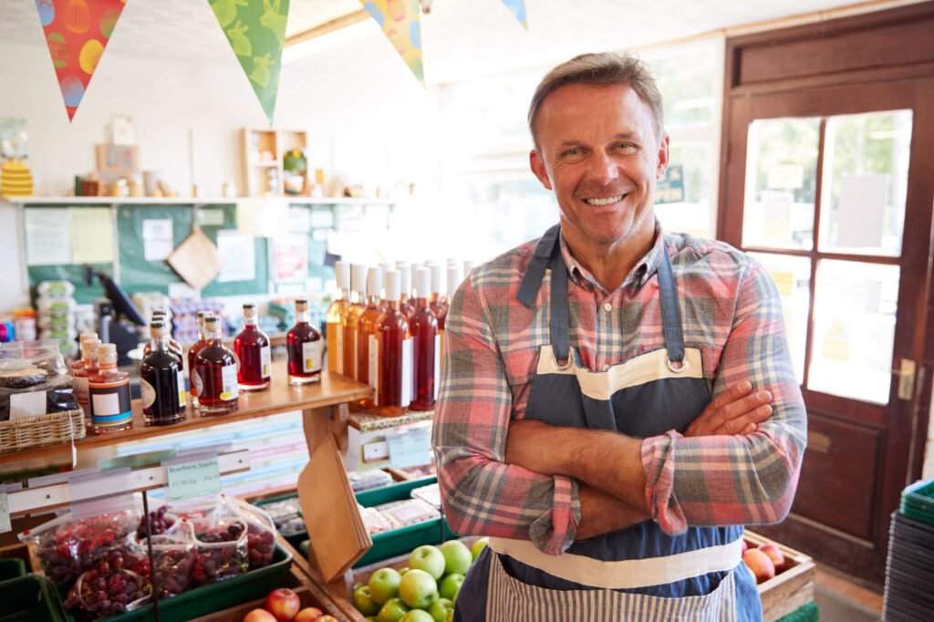 portrait-of-mature-man-running-organic-farm-shop-UTDXG92.jpg